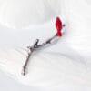 A little red bird perches on a branch. Inspired by Emily Dickinson's poems, the brooch design represents hope and life and is suitable for all occasions.