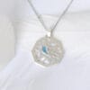 Swallow staying the window The silver necklace features a swallow, a symbol of love and good life, conveying a peaceful and elegant mood.