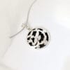 The dance of the Holy Spirit The silver necklace features a flying bird design called ‘Dance of the Holy Spirit’, a symbol of freedom and agility, perfect for any occasion.