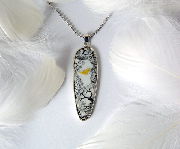 Wings of the wind The "Wings of the wind" silver hand-painted enamel jewelry shows an eagle flying freely in the sky, a design that embodies strength and freedom