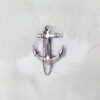 Cross anchor-shaped 925 sterling silver brooch, featuring a delicate design with a dangling silver chain. The polished finish exudes elegance and a stylish nautical theme accessory.