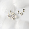 Spring Song1 A delicate 925 sterling silver brooch set named "Spring Song," featuring a bird perched on a branch with musical notes, symbolizing the vitality and warmth of spring, crafted with fine details and artistic elegance.