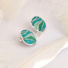 stud earrings inspired by “Still waters run deep,” with blue-green tones and engraved silver. Elegant for daily wear or as a thoughtful gift.