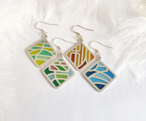 “Four Seasons Imagery” handcrafted enamel earrings featuring openwork cloisonné technique, delicately capturing the colors and moods of spring, summer, autumn, and winter in translucent detail.
