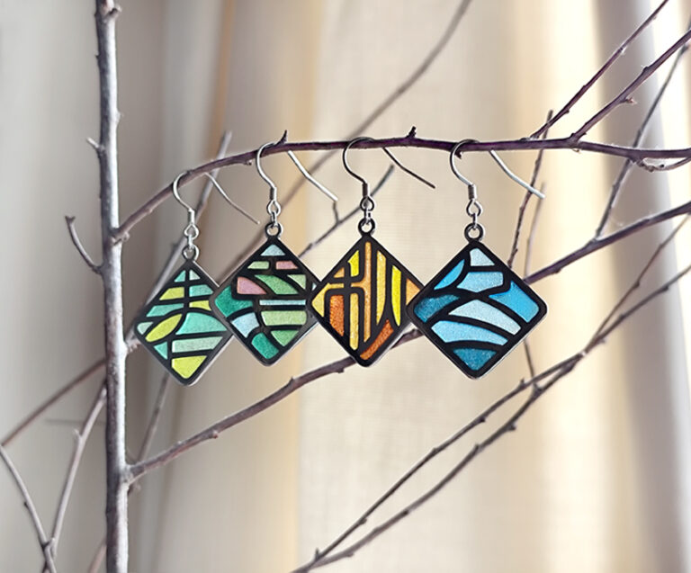 “Four Seasons Imagery” handcrafted enamel earrings featuring openwork cloisonné technique, delicately capturing the colors and moods of spring, summer, autumn, and winter in translucent detail.