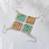 peacejoy Two pairs of handcrafted plique-à-jour enamel earrings in square silver frames, featuring abstract line designs inspired by Chinese characters for “Peace” and “Joy,” with soft blue, pink, and golden hues glowing through openwork patterns, displayed on a white background with soft white feathers.