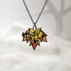 MapleSplendor Handcrafted Maple Splendor Pendant in sterling silver with Plique-à-jour enamel, autumn maple leaf necklace capturing warm light.