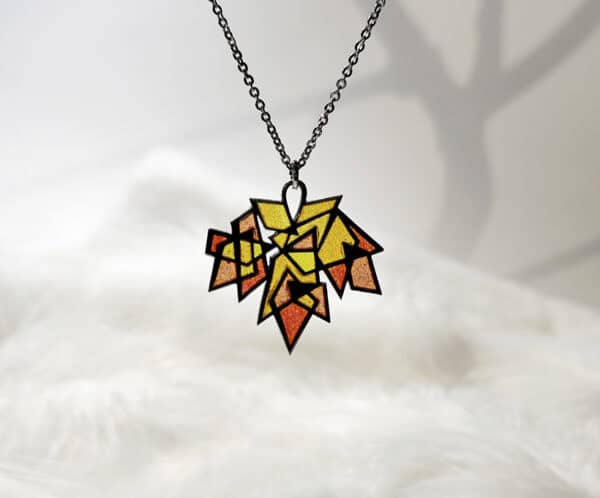 MapleSplendor Handcrafted Maple Splendor Pendant in sterling silver with Plique-à-jour enamel, autumn maple leaf necklace capturing warm light.