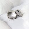 The "Covenant" silver wedding ring features the words "I love You" in Hebrew, one of the oldest scripts in the world, with an engraved tree pattern.
