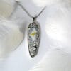 Wings of the wind The "Wings of the wind" silver hand-painted enamel jewelry shows an eagle flying freely in the sky, a design that embodies strength and freedom