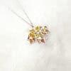 MapleSplendor3 Handcrafted Maple Splendor Pendant in sterling silver with Plique-à-jour enamel, autumn maple leaf necklace capturing warm light.