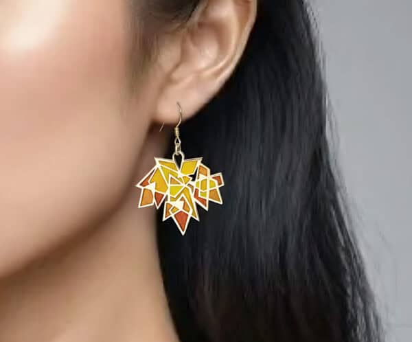 Close-up profile of the model wearing the light-as-maple-wings 'Autumn Rhapsody' enamel earrings. The earrings sway with movement, highlighting the model's face.