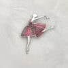 Close-up of the "Dancing Moments" Champlevé Enamel 925 silver ballerina brooch against a white feather background. Features a geometric pink-lavender translucent enamel skirt with visible chiseled texture.