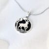 The silver necklace "Like a Deer Praises for Water" is inspired by a Bible poem, in which a deer in the forest longs for a cool, sweet stream of water in its thirst.