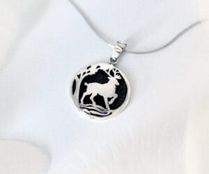 The silver necklace "Like a Deer Praises for Water" is inspired by a Bible poem, in which a deer in the forest longs for a cool, sweet stream of water in its thirst.