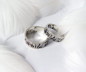 The "Covenant" silver wedding ring features the words "I love You" in Hebrew, one of the oldest scripts in the world, with an engraved tree pattern.