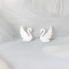 A pair of hand-made silver white swan-shaped earrings, the elegant design shows exquisite craftsmanship and unique style.