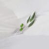 The silver green olive brooch with fruits decorated with green enamel symbolizes peace and harvest and is suitable for wearing on all occasions.