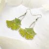 A pair of ginkgo leaf earrings in translucent enamel that showcase natural elegance and vivid green, perfect for everyday wear and special occasions.