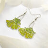 A pair of ginkgo leaf earrings in translucent enamel that showcase natural elegance and vivid green, perfect for everyday wear and special occasions.