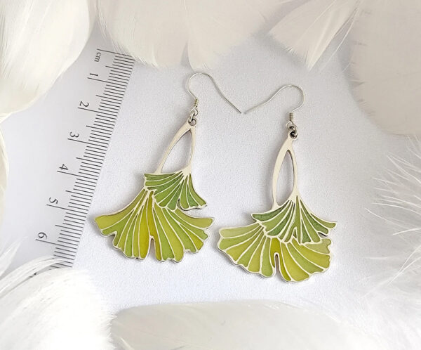 A pair of ginkgo leaf earrings in translucent enamel that showcase natural elegance and vivid green, perfect for everyday wear and special occasions.