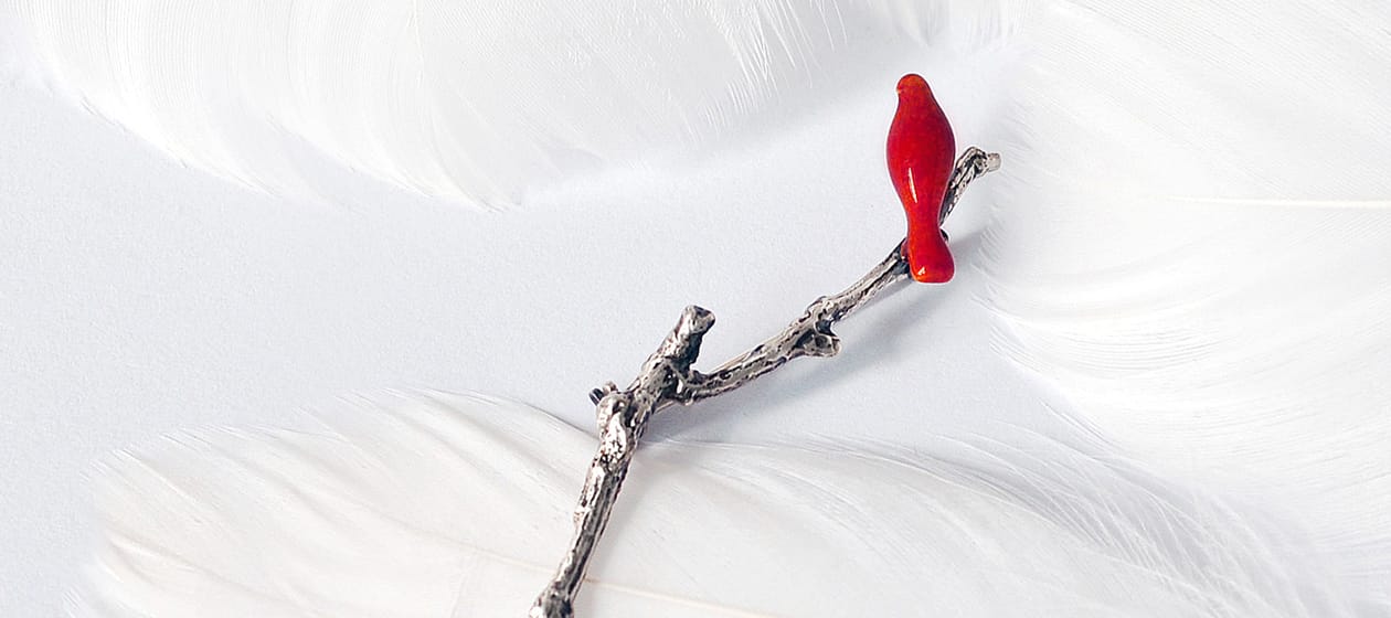 a red bird on a branch