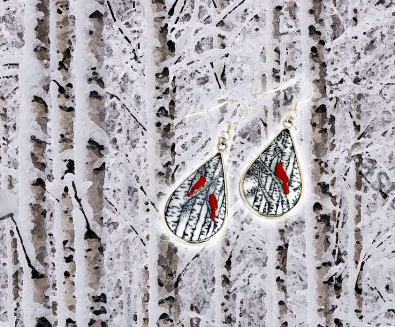 Winter Melody hand-painted enamel earrings featuring red enamel birds perched on snow-covered poplar branches, designed in a water-drop asymmetric style, capturing the warmth and beauty of winter.