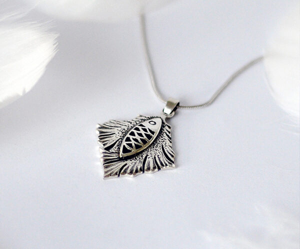 925 silver handmade necklace with a fish design, symbolizing "abundance and prosperity" and good fortune, inspired by Matthew 4:19, combining the traditional meaning of Chinese New Year.