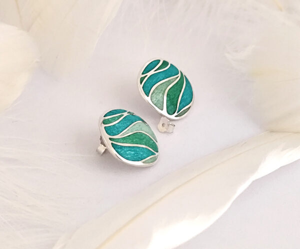stud earrings inspired by “Still waters run deep,” with blue-green tones and engraved silver. Elegant for daily wear or as a thoughtful gift.