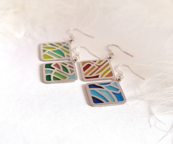 “Four Seasons Imagery” handcrafted enamel earrings featuring openwork cloisonné technique, delicately capturing the colors and moods of spring, summer, autumn, and winter in translucent detail.