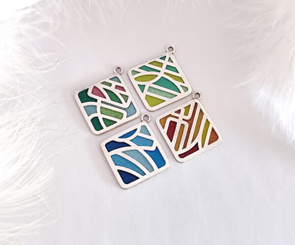 “Four Seasons Imagery” handcrafted enamel earrings featuring openwork cloisonné technique, delicately capturing the colors and moods of spring, summer, autumn, and winter in translucent detail.